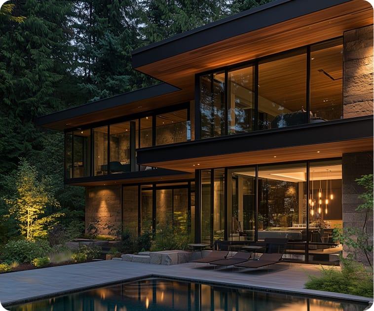 Contemporary home with pool at night